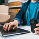 Person Managing E-commerce Orders on Laptop at Home Fulfillment Workspace Person Managing E-commerce Orders on Laptop at Home Fulfillment Workspace - PhotoDune Item for Sale