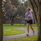 Woman jogging in park path for fitness lifestyle outdoors Woman jogging in park path for fitness lifestyle outdoors - PhotoDune Item for Sale
