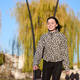 Young woman roller skating in city park and smiling in warm autumn light Young woman roller skating in city park and smiling in warm autumn light - PhotoDune Item for Sale