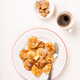 Dutch small pancakes poffertjes served with butter, sugar cubes, and coffee on white background Dutch small pancakes poffertjes served with butter, sugar cubes, and coffee on white background - PhotoDune Item for Sale