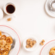 Dutch small pancakes poffertjes served with coffee, cream, and sugar cubes on a light table Dutch small pancakes poffertjes served with coffee, cream, and sugar cubes on a light table - PhotoDune Item for Sale