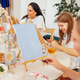 Group of women engaged in creative painting activity at a bright studio, with easels, colorful paint Group of women engaged in creative painting activity at a bright studio, with easels, colorful paint - PhotoDune Item for Sale