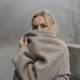 Woman in a coat on a rural road in foggy weather. Woman in a coat on a rural road in foggy weather. - PhotoDune Item for Sale