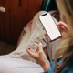 Woman at home managing medication with a mobile health app and pill organizer for better adherence Woman at home managing medication with a mobile health app and pill organizer for better adherence - PhotoDune Item for Sale