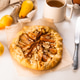 Freshly baked galette with pear on baking paper Freshly baked galette with pear on baking paper - PhotoDune Item for Sale