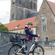 Young girl helmet stands bicycle cobblestone bridge historic european Magdeburg city cathedral tower Young girl helmet stands bicycle cobblestone bridge historic european Magdeburg city cathedral tower - PhotoDune Item for Sale