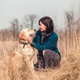 Woman cuddling cute dog Woman cuddling cute dog - PhotoDune Item for Sale