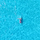 Vertical aerial drone view of friends having summer fun on SUP boards. Vertical aerial drone view of friends having summer fun on SUP boards. - PhotoDune Item for Sale