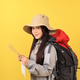 Young Asian Female with Carrier Backpack, Hiking Clotes, Looking at Maps. Young Asian Female with Carrier Backpack, Hiking Clotes, Looking at Maps. - PhotoDune Item for Sale