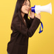 Asian Woman with Megaphone Isolated on Yellow Background Asian Woman with Megaphone Isolated on Yellow Background - PhotoDune Item for Sale