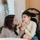 Mother supporting child with cerebral palsy during sensory activity Mother supporting child with cerebral palsy during sensory activity - PhotoDune Item for Sale