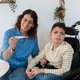 Nurse checking temperature of boy with cerebral palsy Nurse checking temperature of boy with cerebral palsy - PhotoDune Item for Sale