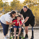 Family bonding outdoors with disabled child and prosthetic leg Family bonding outdoors with disabled child and prosthetic leg - PhotoDune Item for Sale