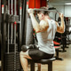 Man exercises with weights in a gym while focusing on strength training for upper body Man exercises with weights in a gym while focusing on strength training for upper body - PhotoDune Item for Sale