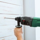 Worker uses drill to make hole in wooden wall during home improvement project Worker uses drill to make hole in wooden wall during home improvement project - PhotoDune Item for Sale