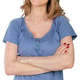 Woman smiles and poses with arms crossed in a simple setting during the daytime Woman smiles and poses with arms crossed in a simple setting during the daytime - PhotoDune Item for Sale
