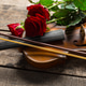 Violin and red roses placed on a wooden table for a special occasion Violin and red roses placed on a wooden table for a special occasion - PhotoDune Item for Sale