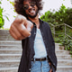 Happy man pointing finger at camera outdoors Happy man pointing finger at camera outdoors - PhotoDune Item for Sale