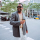 Happy man walking street with coffee wearing sunglasses Happy man walking street with coffee wearing sunglasses - PhotoDune Item for Sale