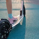 Close up of child legs riding kick scooter on playground Close up of child legs riding kick scooter on playground - PhotoDune Item for Sale