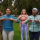 Group of multi generational women doing yoga class at city park Group of multi generational women doing yoga class at city park - PhotoDune Item for Sale