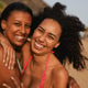 Happy diverse latin women hugging each other during summer vacation on the beach Happy diverse latin women hugging each other during summer vacation on the beach - PhotoDune Item for Sale