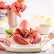 Cooked and tasty lobster with tongs and hammer to crack. Cooked and tasty lobster with tongs and hammer to crack. - PhotoDune Item for Sale