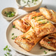 Delicious sausage in puff pastry with thyme and sesame seeds. Delicious sausage in puff pastry with thyme and sesame seeds. - PhotoDune Item for Sale