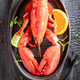 Boiled and spicy lobster with hammer and splitting tongs. Boiled and spicy lobster with hammer and splitting tongs. - PhotoDune Item for Sale