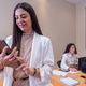 Confident businesswoman holding tablet in office meeting, colleagues working in background, focused Confident businesswoman holding tablet in office meeting, colleagues working in background, focused - PhotoDune Item for Sale