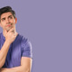 Thinking Man Looking Up, Searching Opportunity On violet Background. Curious Thinking Man Looking Up, Searching Opportunity On violet Background. Curious - PhotoDune Item for Sale