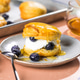Scone Filled with Blueberry and Clotted Cream on a plate Scone Filled with Blueberry and Clotted Cream on a plate - PhotoDune Item for Sale