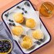 Scone Filled with Strawberry Jam and Clotted Cream on a plate Scone Filled with Strawberry Jam and Clotted Cream on a plate - PhotoDune Item for Sale