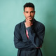 Young man thinking with hand on chin portrait Young man thinking with hand on chin portrait - PhotoDune Item for Sale
