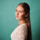 Young woman looking back with long hair and white lace dress Young woman looking back with long hair and white lace dress - PhotoDune Item for Sale