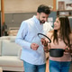Couple shopping for new kitchenware in home store Couple shopping for new kitchenware in home store - PhotoDune Item for Sale