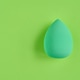 Green Makeup Sponge Floating On Vivid Green Background Flat Lay With Subtle Shadow Minimalist Green Makeup Sponge Floating On Vivid Green Background Flat Lay With Subtle Shadow Minimalist - PhotoDune Item for Sale