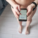 Top View Of Person Standing On A Digital Scale Checking Weight On A Smartphone App For Health Top View Of Person Standing On A Digital Scale Checking Weight On A Smartphone App For Health - PhotoDune Item for Sale