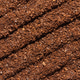 Ground Coffee Forming Diagonal Ridged Pattern On Coarse Brown Surface Close-Up Studio Composition Ground Coffee Forming Diagonal Ridged Pattern On Coarse Brown Surface Close-Up Studio Composition - PhotoDune Item for Sale