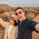 Young couple enjoying outdoor desert adventure selfie at sunset Young couple enjoying outdoor desert adventure selfie at sunset - PhotoDune Item for Sale