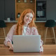 Redhead woman freelancer working remotely from home kitchen Redhead woman freelancer working remotely from home kitchen - PhotoDune Item for Sale
