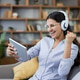 Happy woman celebrating success while winning online game Happy woman celebrating success while winning online game - PhotoDune Item for Sale