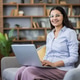 Young woman working remotely on laptop from home Young woman working remotely on laptop from home - PhotoDune Item for Sale