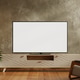 Blank TV screen mockup on wooden cabinet in modern living room interior with plants and armchair Blank TV screen mockup on wooden cabinet in modern living room interior with plants and armchair - PhotoDune Item for Sale