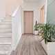 Modern office hallway with marble stairs wood floor and indoor plants in white pots Modern office hallway with marble stairs wood floor and indoor plants in white pots - PhotoDune Item for Sale