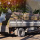 Sod delivery truck loaded with fresh turf rolls in spring yard Sod delivery truck loaded with fresh turf rolls in spring yard - PhotoDune Item for Sale