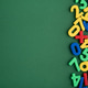 Colorful learning numbers and math symbols on green background Colorful learning numbers and math symbols on green background - PhotoDune Item for Sale