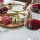 Wine and cheese board with charcuterie and appetizers Wine and cheese board with charcuterie and appetizers - PhotoDune Item for Sale