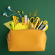 Yellow pencil case opening with school supplies Yellow pencil case opening with school supplies - PhotoDune Item for Sale