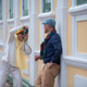 Senior LGBTQ traveler photographing his partner against a colorful heritage building in Bangkok Old Senior LGBTQ traveler photographing his partner against a colorful heritage building in Bangkok Old - PhotoDune Item for Sale